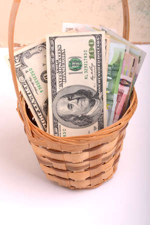 money set in a basket, dollars, euro moneyの写真素材