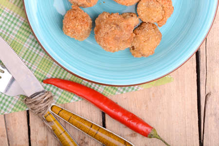 meat chop on blue plate with red pepperの写真素材