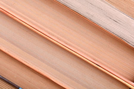 Old books leaning against each other for saleの写真素材