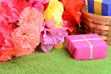 present gift box and flower bouquet on silkの写真素材