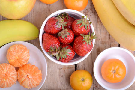 Fresh colorful fruits composition mandarin, bananas and orangeの写真素材