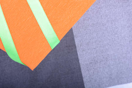 orange gift box with green ribbon