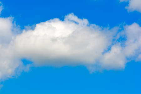 white fluffy clouds in the blue sky