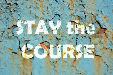 stay the course words print on the grunge metallic wallの写真素材