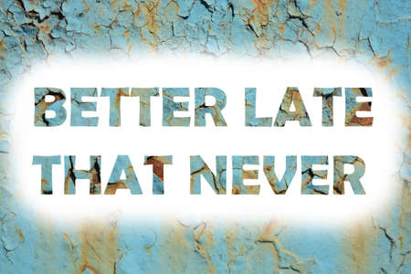 better late that never words print on the grunge metallic wallの写真素材