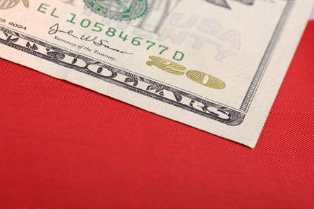 twenty dollar bill in front of the American flagの写真素材