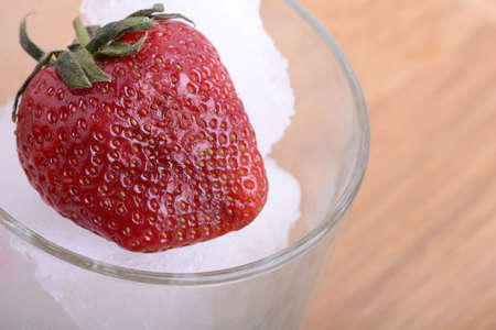 Summer dessert. fresh strawberries and ice close upの写真素材