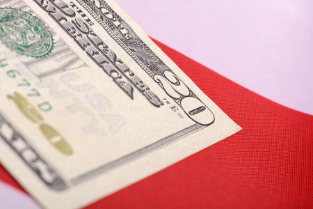 twenty dollar bill in front of the American flagの写真素材