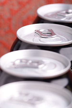 white metal beer cans background close upの写真素材