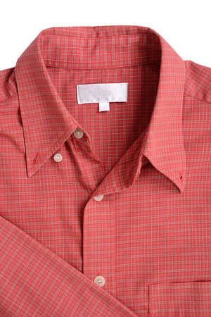 Close up of a red mens shirts isolated on whiteの写真素材