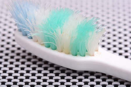 Used old toothbrush toothbrush on a black and white background.