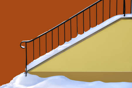 Snowed entrance to the building. Path for stairs.の写真素材