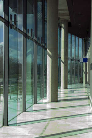 Modern office park interior. Glass wall and cement pillars. Polish Olimpic Comitee building.の写真素材