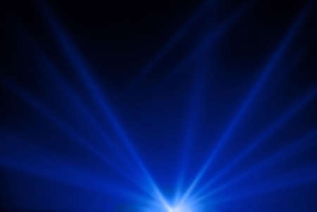 Night sky illuminated by projectors の写真素材