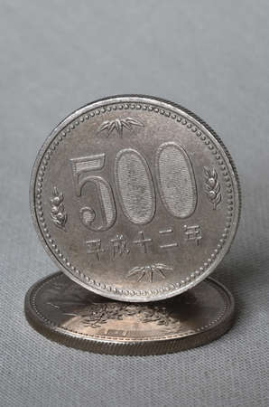Two japanese coins on oriental backgroundの写真素材