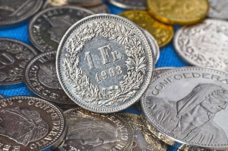 Swiss coins  One franc in focus, others blured by lens の写真素材