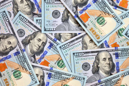 Hundreds of new printed american dollars as financial background