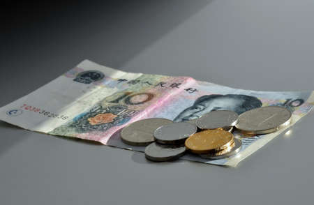 Chinese currency. Coins and ten Yuan bank note.の写真素材