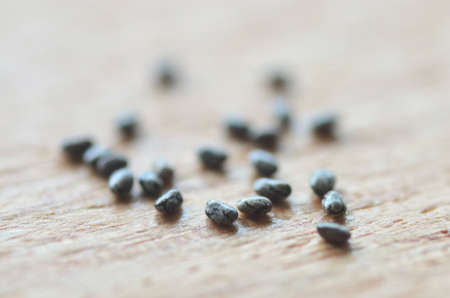 Chia seed extreme close up. Macro image. Exotic wood background.の写真素材