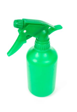Green plastic spray bottle isolated on whiteの写真素材
