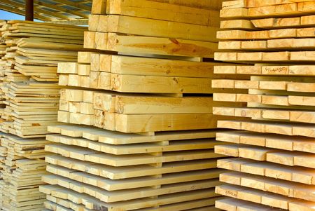 Assorted stacked lumber on stock of commercial timber