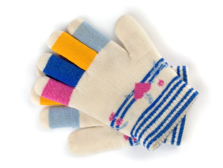 Pair of white children's knitted winter glove isolated on whiteの写真素材