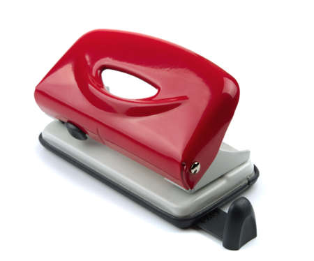 Red office hole puncher isolated on whiteの写真素材