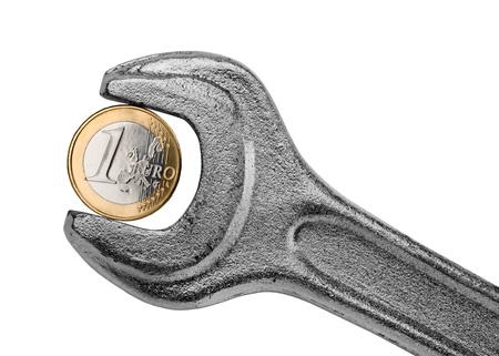 Euro coin and wrench as symbol of configuration european economicsの写真素材