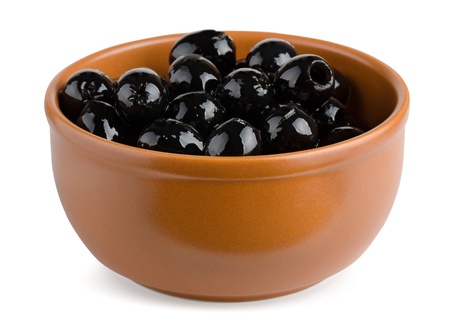 Terracotta bowl of black pitted olives isolated on whiteの写真素材