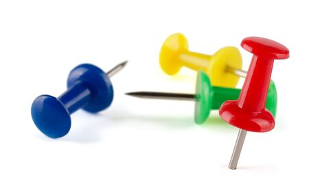 Colorful push pins isolated on white