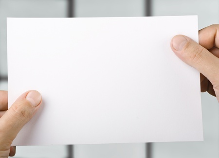 White blank sheet of paper in  hands
