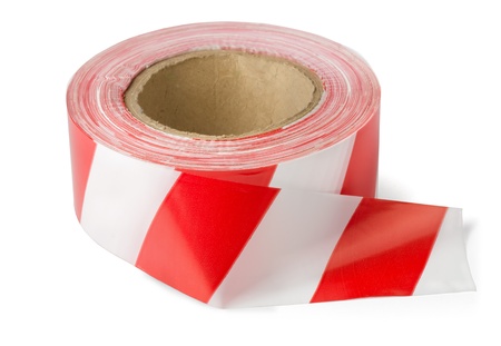 Roll of red white barrier tape isolated on whiteの写真素材