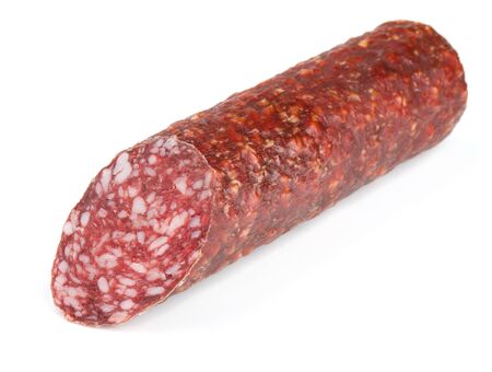 Piece of fresh dry smoked sausage isolated on whiteの写真素材