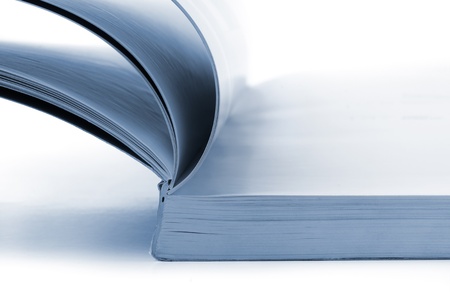 Close up of open catalog on white background