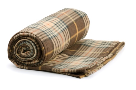 Rolled plaid wool blanket isolated on whiteの写真素材
