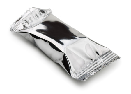 Closed food foil package isolated on whiteの写真素材