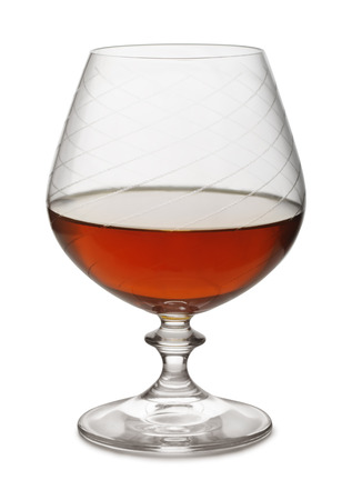 Snifter of aged brandy isolated on whiteの写真素材