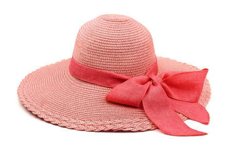 Pink straw hat with bow isolated on whiteの写真素材