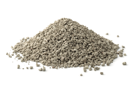 Pile of clumping cat litter isolated on whiteの写真素材