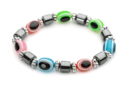 Colorful glass bracelet isolated on whiteの写真素材