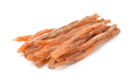 Dried salted fish sticks isolated on whiteの写真素材
