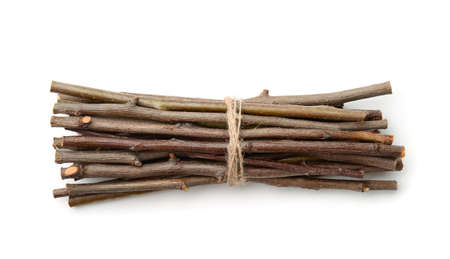 Bunch of wooden twigs isolated on whiteの写真素材