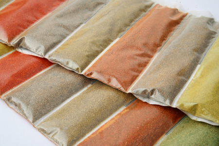Close up of various ground spices packetsの写真素材