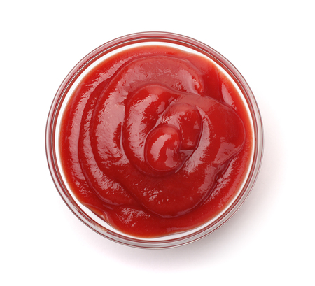 Bowl of  tomato sauce isolated on whiteの写真素材