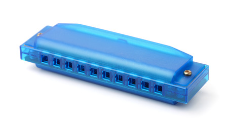 Blue plastic harmonica isolated on white