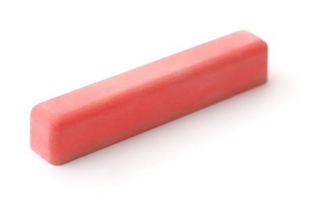 Piece of red chalk isolated on whiteの写真素材