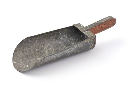 Old metal flour scoop isolated on whiteの写真素材