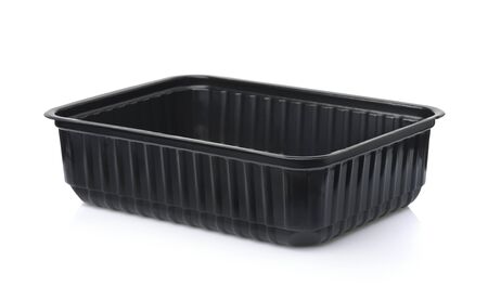Empty black plastic disposable food container isolated on whiteの写真素材