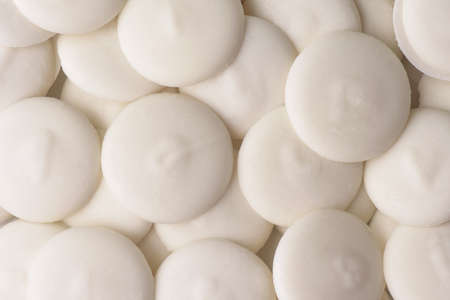 Top view of white chocolate buttons backgroundの写真素材