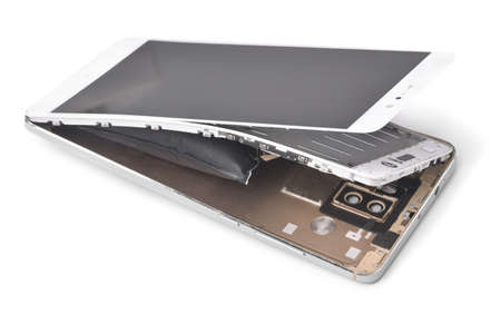 Broken smartphone with  swollen battery isolated on white